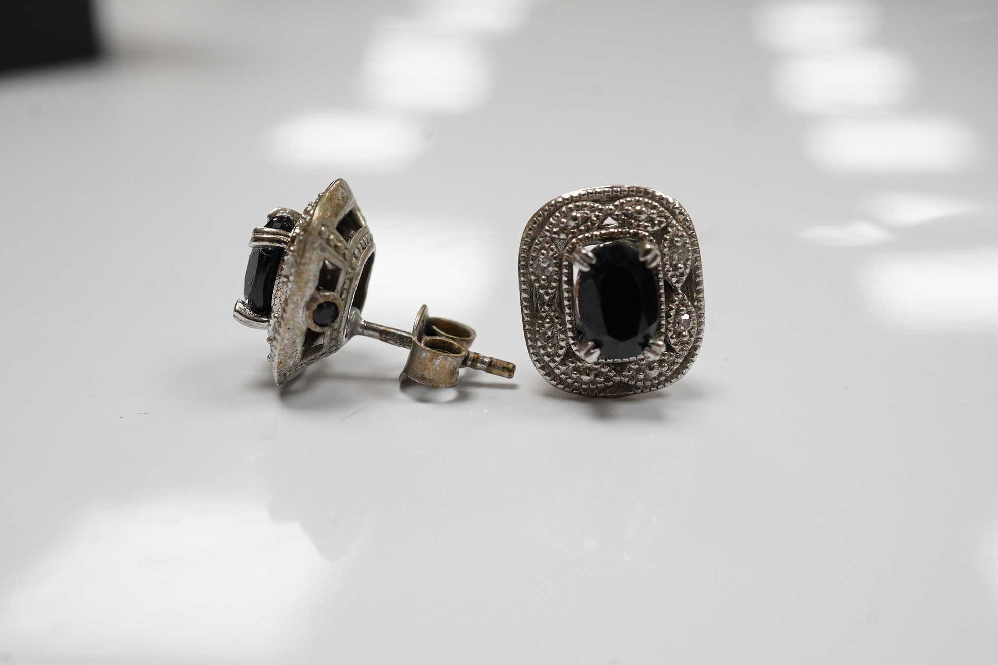 A modern pair of 925, sapphire and diamond set ear studs. Condition - fair to good